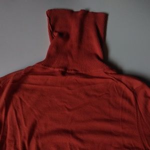 Bright orange turtleneck sweater